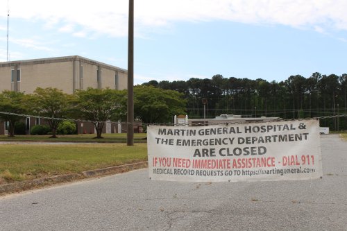 A photo of a sign that reads, "Martin General Hospital & the emergency department are closed."