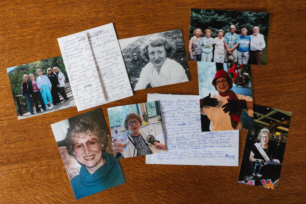 Photos and handwritten notes are displayed on a tabletop