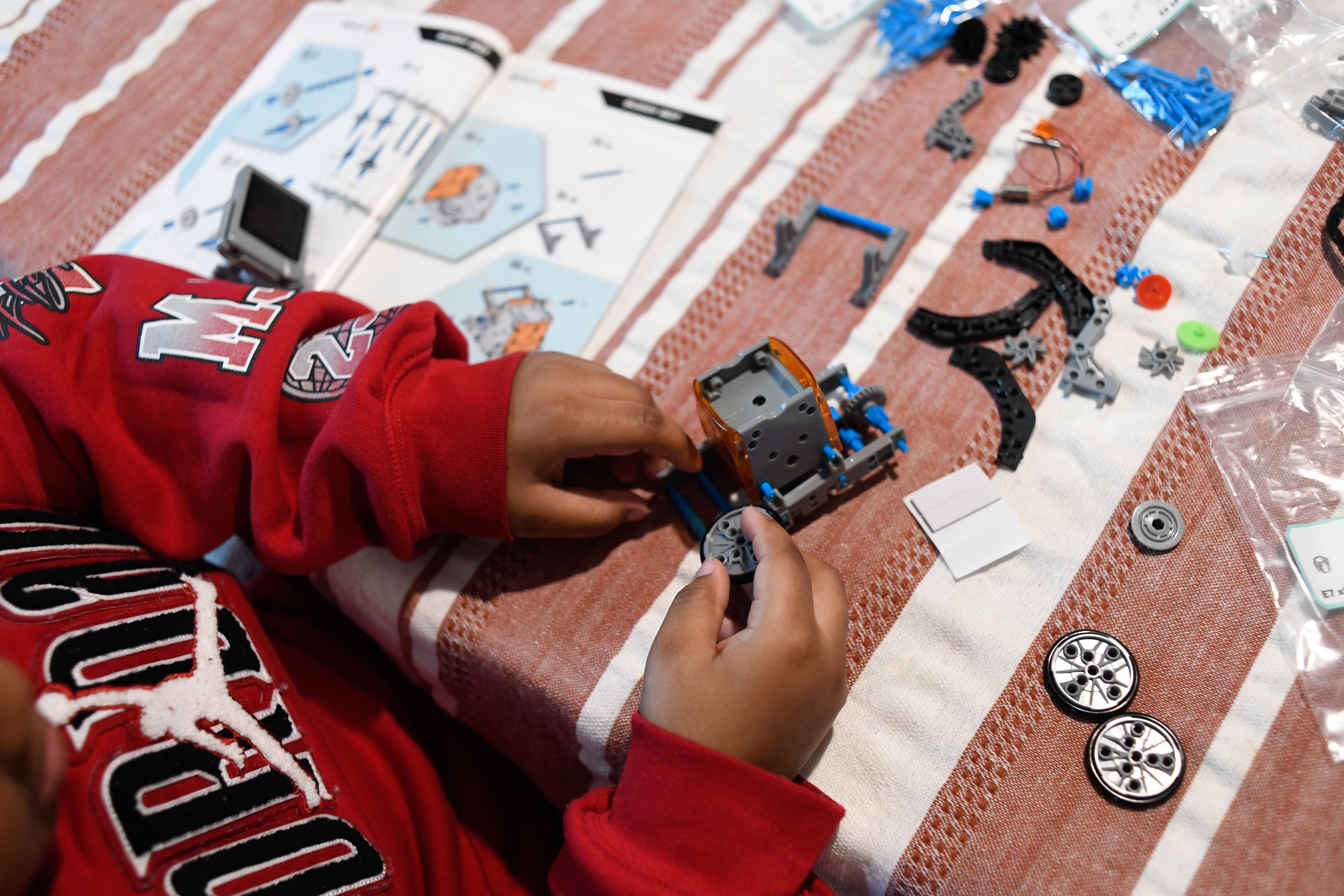 A child plays with toys at a table
