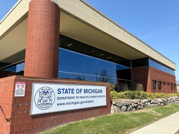 An image of a building where the sign on its wall reads, "State of Michigan Department of Health & Human Services."