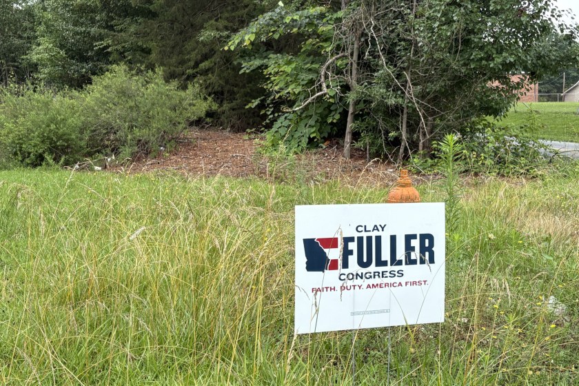 A political campaign poster that reads Fuller in a yard