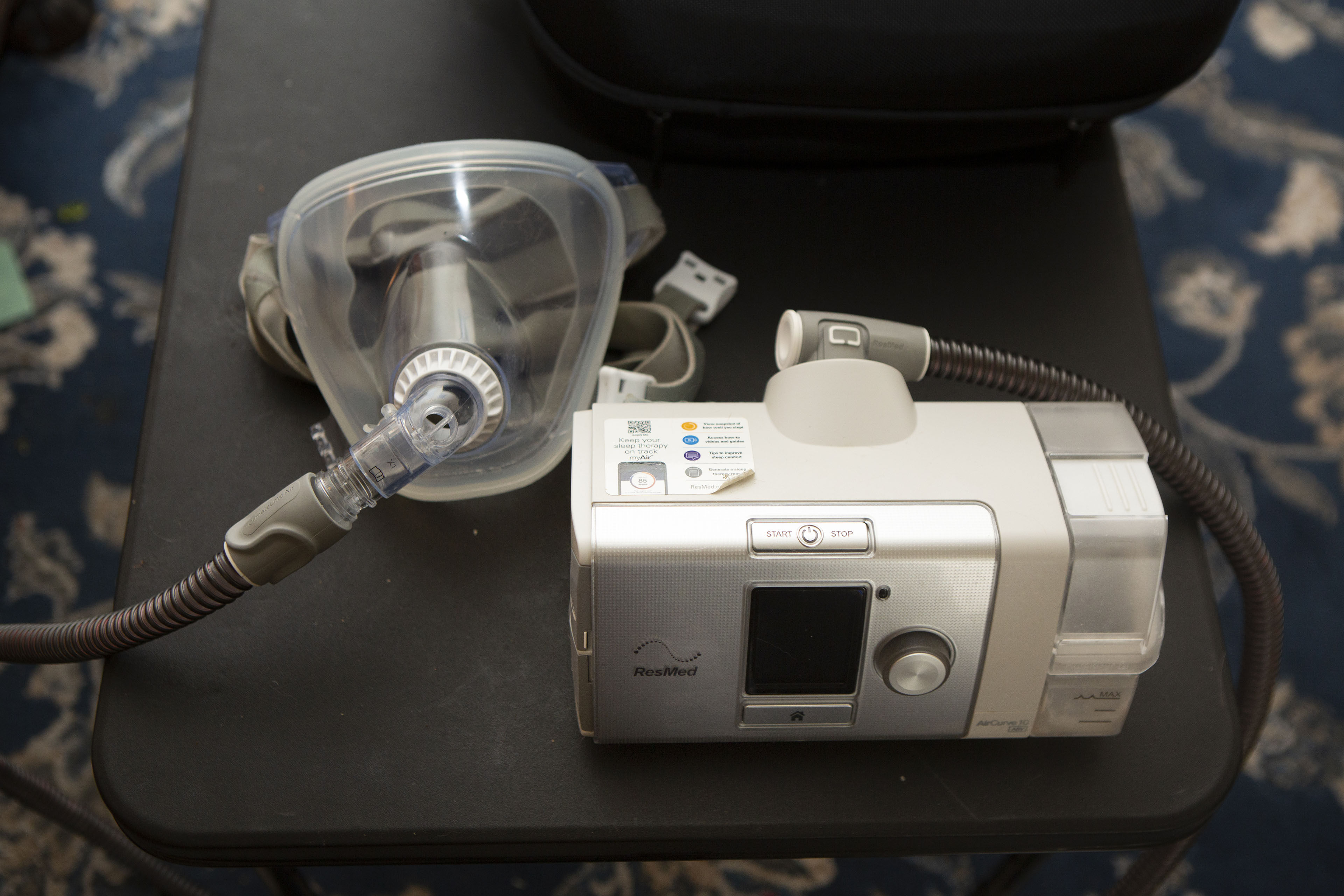 A medical device used for obstructive sleep apnea sits on a table.