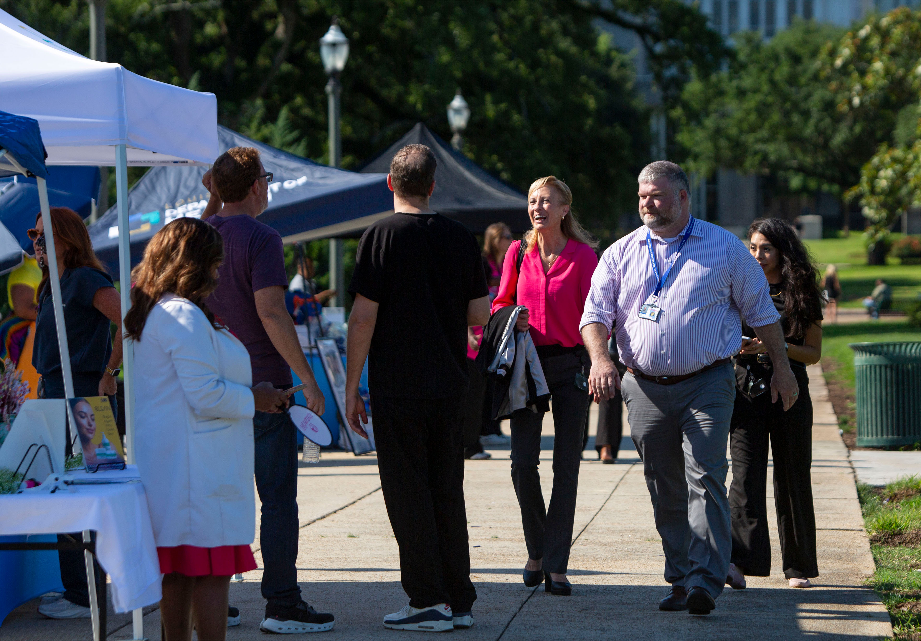 A photo of Evelyn Griffin walking outside at an event.