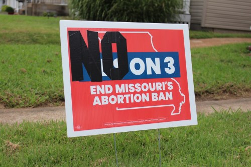 A photo of a yard sign that reads, "NO on 3. End Missouri's abortion ban." The "NO" on the sign is in duct tape.