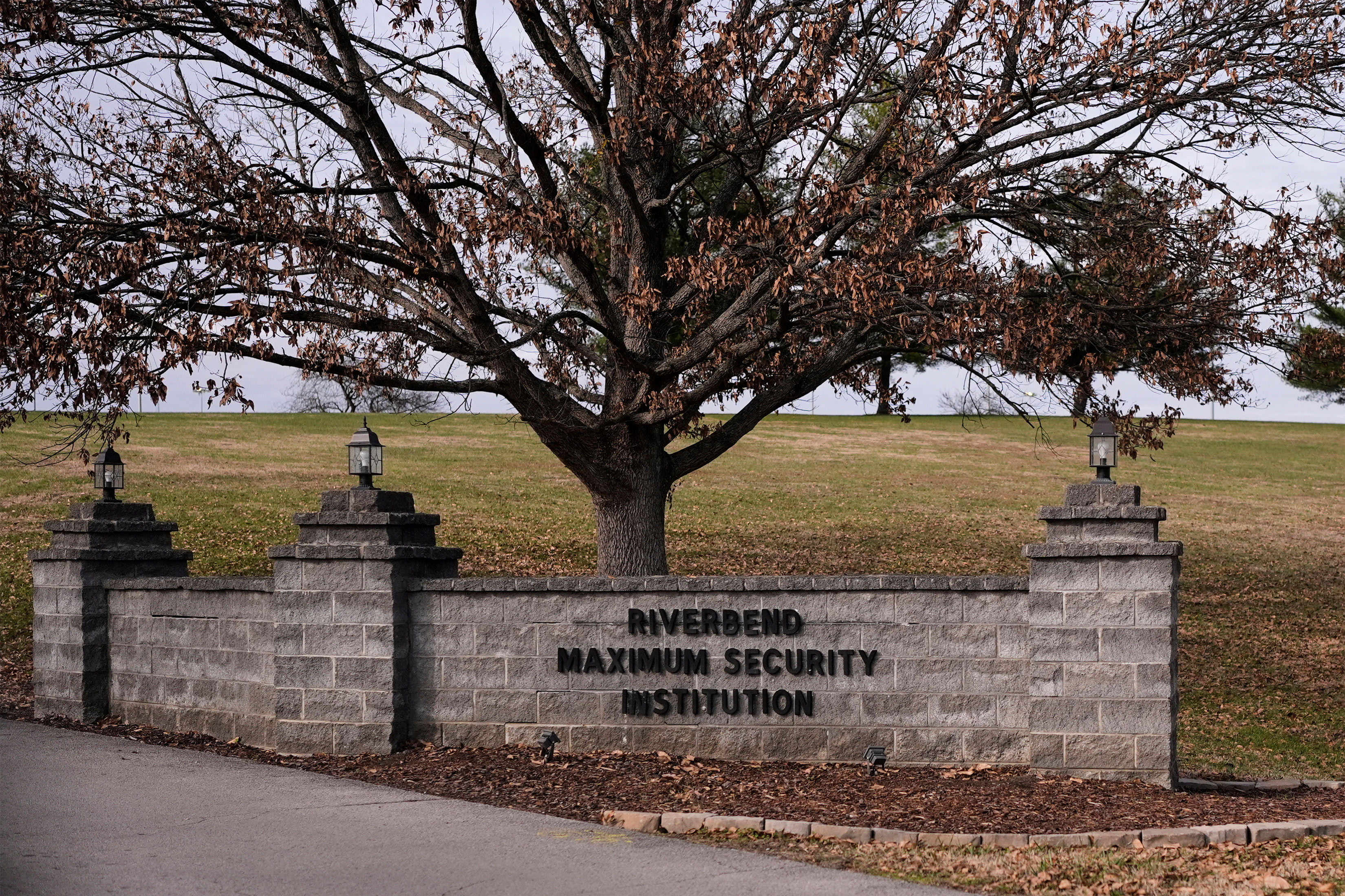 A photo of a sign outside the Riverbend Maximum Security Institution.