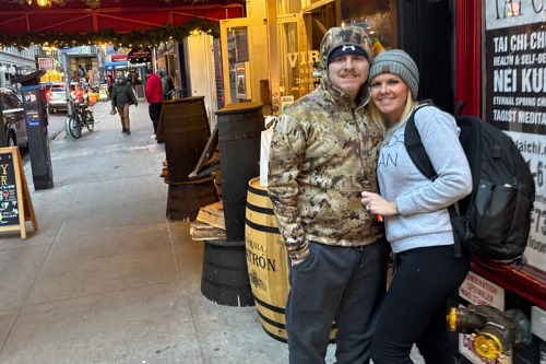 A photo of Mason Henderson and his mother, Tabitha Lowe, outside a shop in New York.