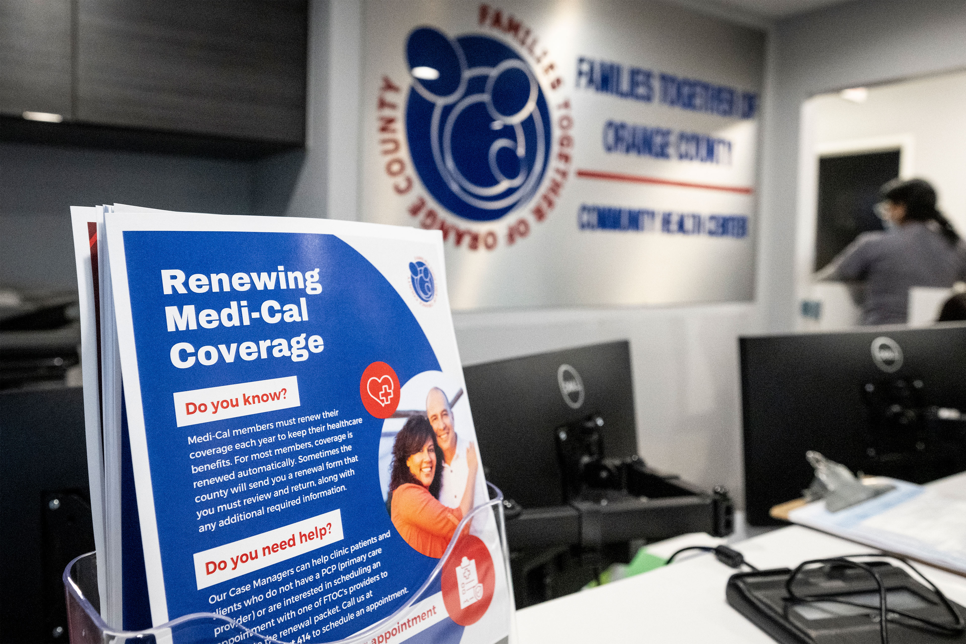 A stand holds up a set of flyers. They read, "Renewing Medi-Cal Coverage: Do you know? Medi-Cal members must renew their coverage each year to keep their healthcare benefits. For most members, coverage is renewed automatically. Sometimes the county will send you a renewal form that you must renew and return, along with any additional required information."