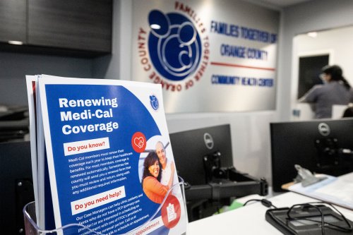 A stand holds up a set of flyers. They read, "Renewing Medi-Cal Coverage: Do you know? Medi-Cal members must renew their coverage each year to keep their healthcare benefits. For most members, coverage is renewed automatically. Sometimes the county will send you a renewal form that you must renew and return, along with any additional required information."